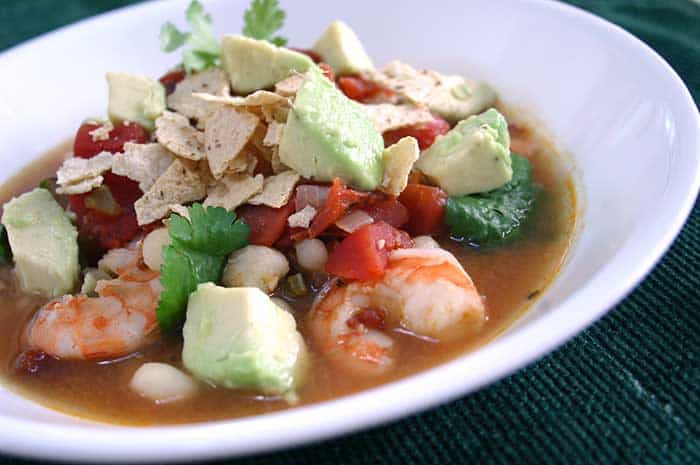 Spicy Shrimp Soup with Avocado in a white bowl