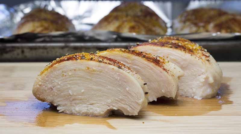 Sliced chicken breast on a cutting board