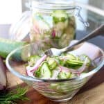 Pickled cucumber salad in glass bowl