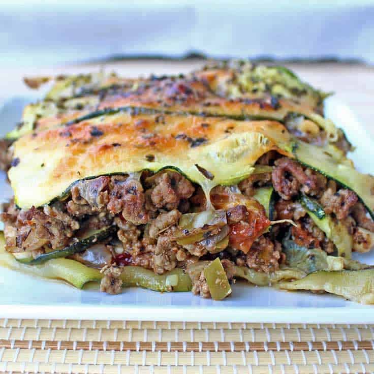 Close-up of low-carb zucchini lasagna on a white plate
