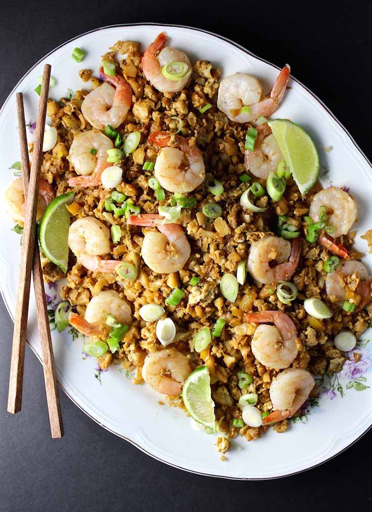 Fried Cauliflower Rice & Shrimp on a plate with chopsticks