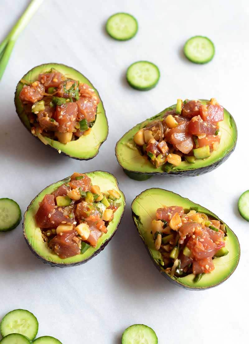 Poke made from ahi tuna, served in four avocado halves, as seen from above