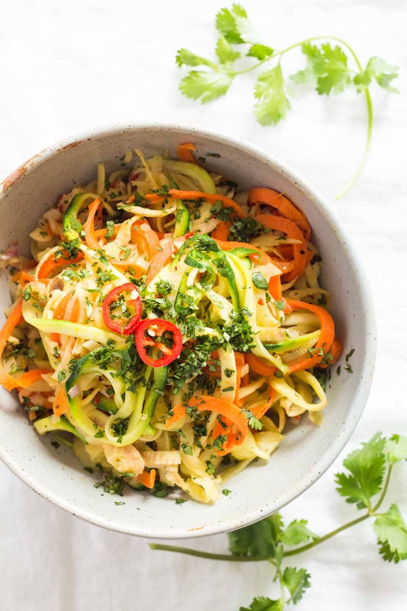 Bowl of Vegetable Noodle Stir-Fry garnished with chili and parsley as seen from above