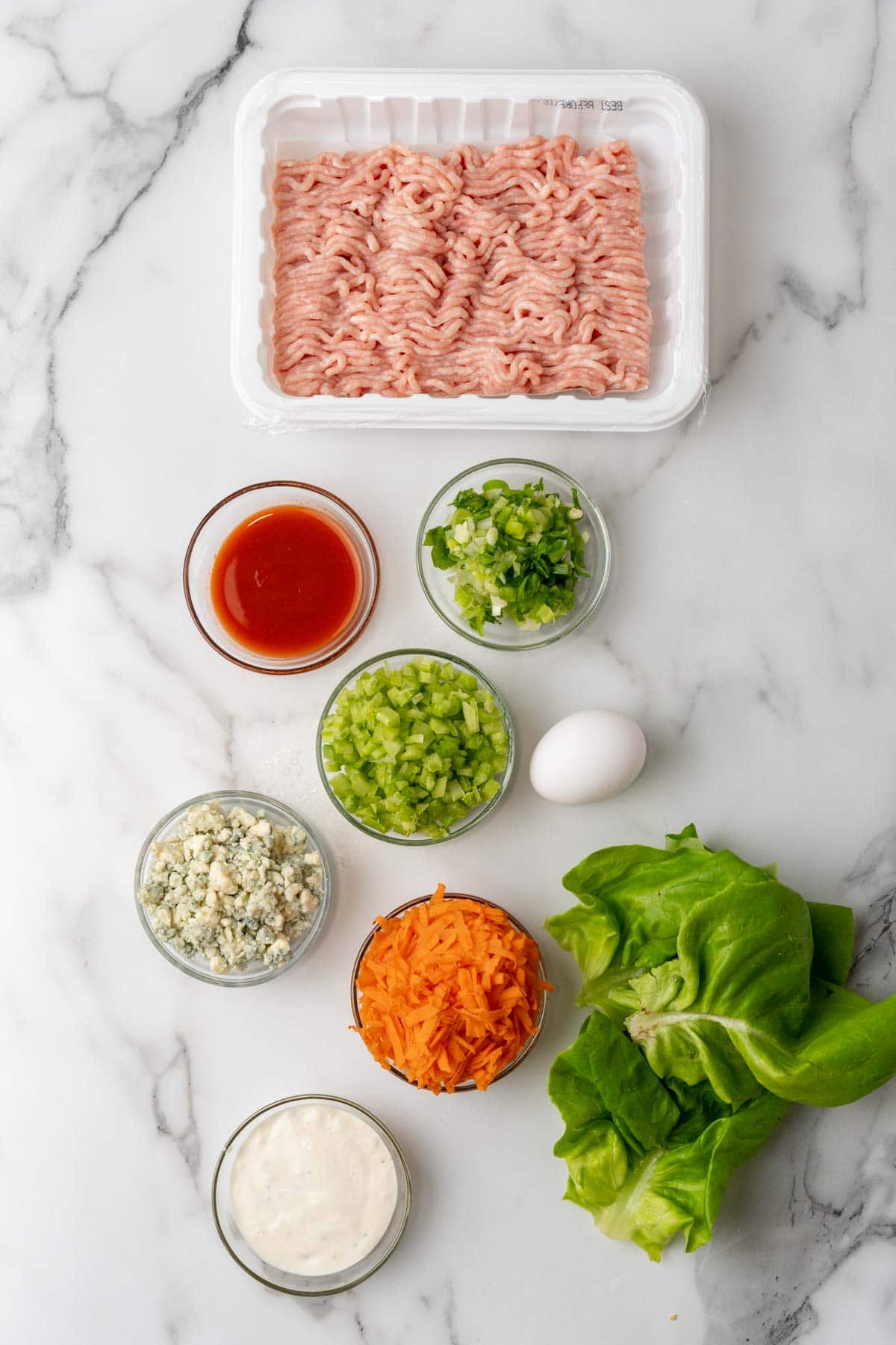 Burger ingredients arranged on a table 