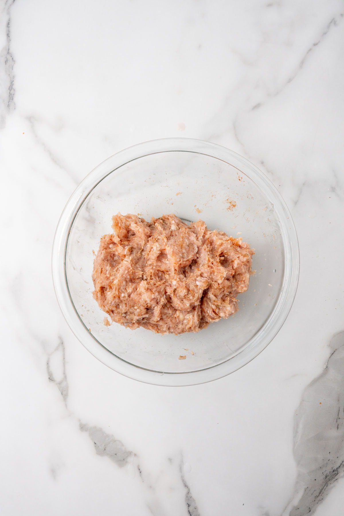 Sausage patty mixture in a glass bowl