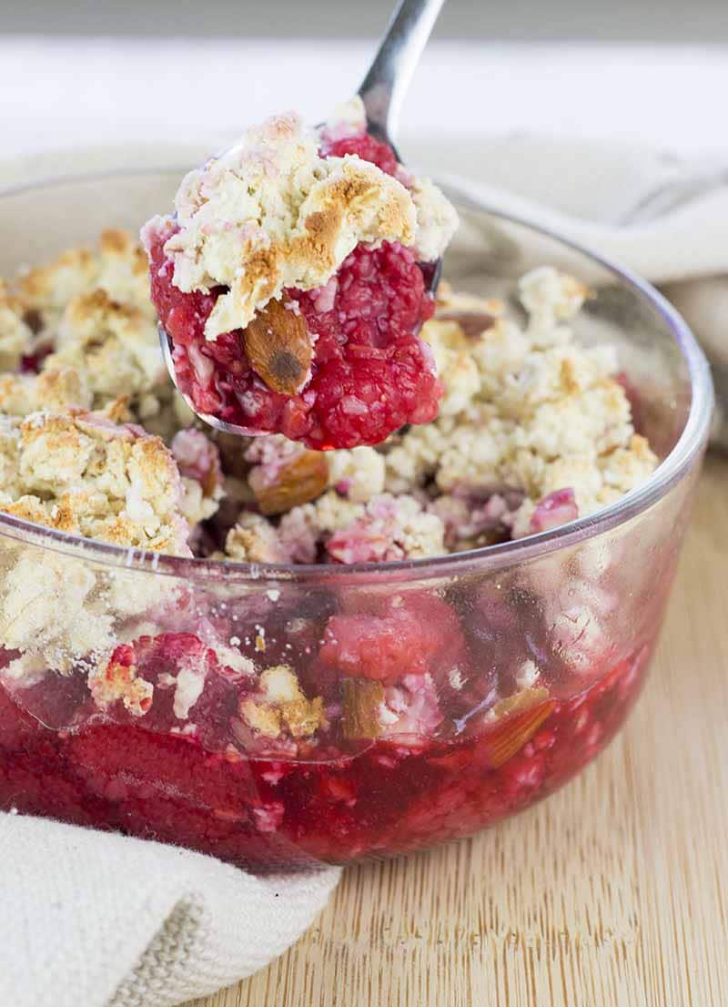 Scooping a spoonful of Protein Berry Crumble from the bowl