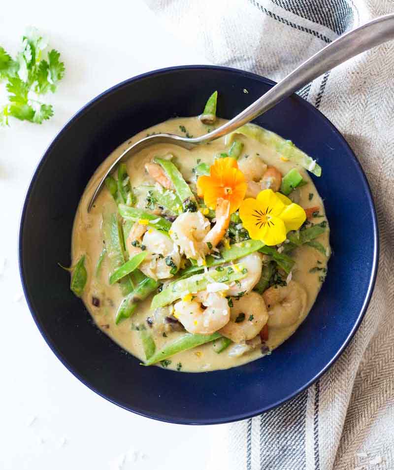 A bowl of Thai Green Curry with Shrimp seen from above
