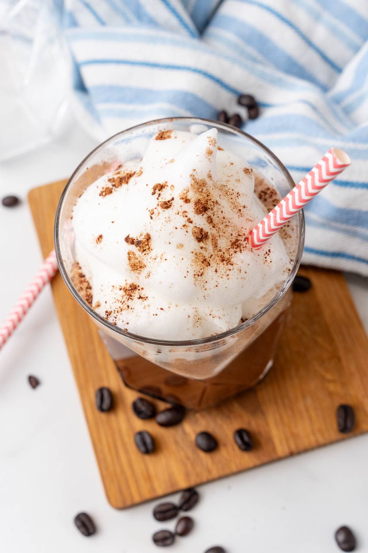 Chocolate Coffee Protein Shake surrounded by coffee beans