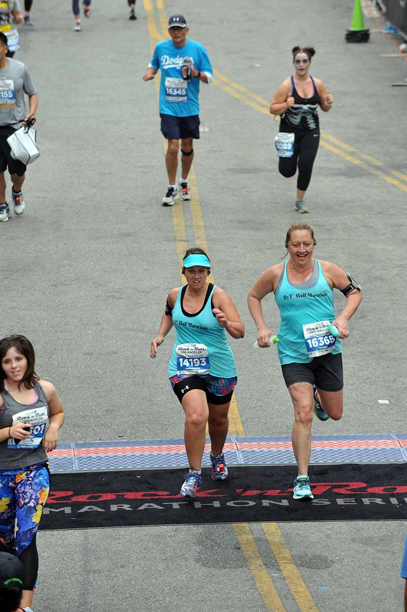 Jennifer and Jenna crossing the finish line