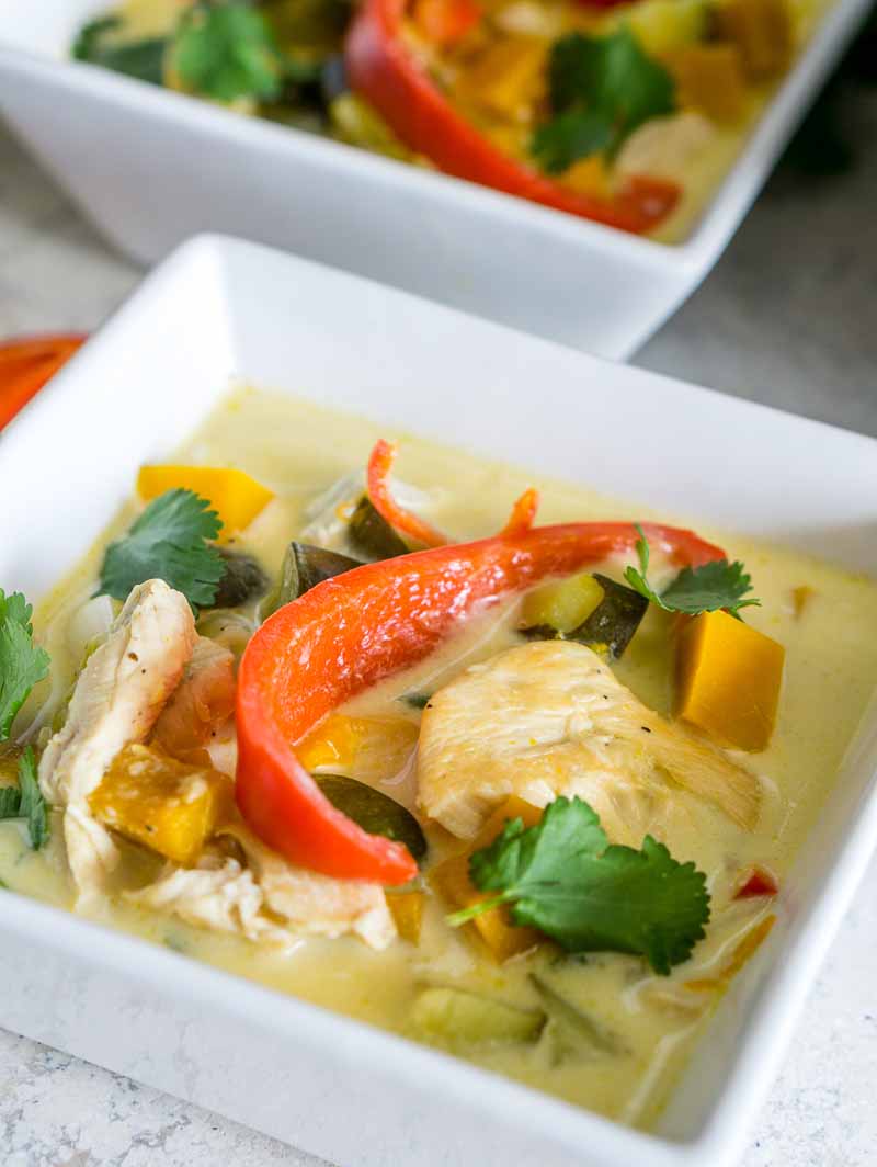 Closeup of a bowl of coconut chicken soup