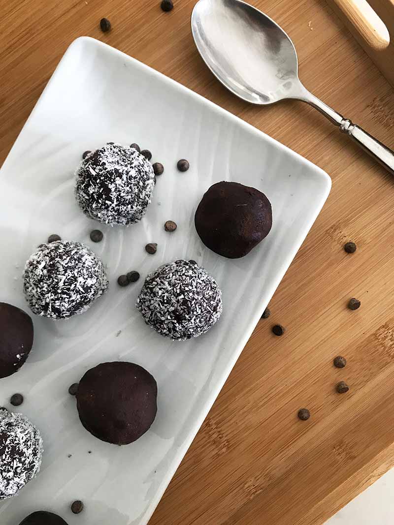 Chocolate keto fat bombs on a white plate