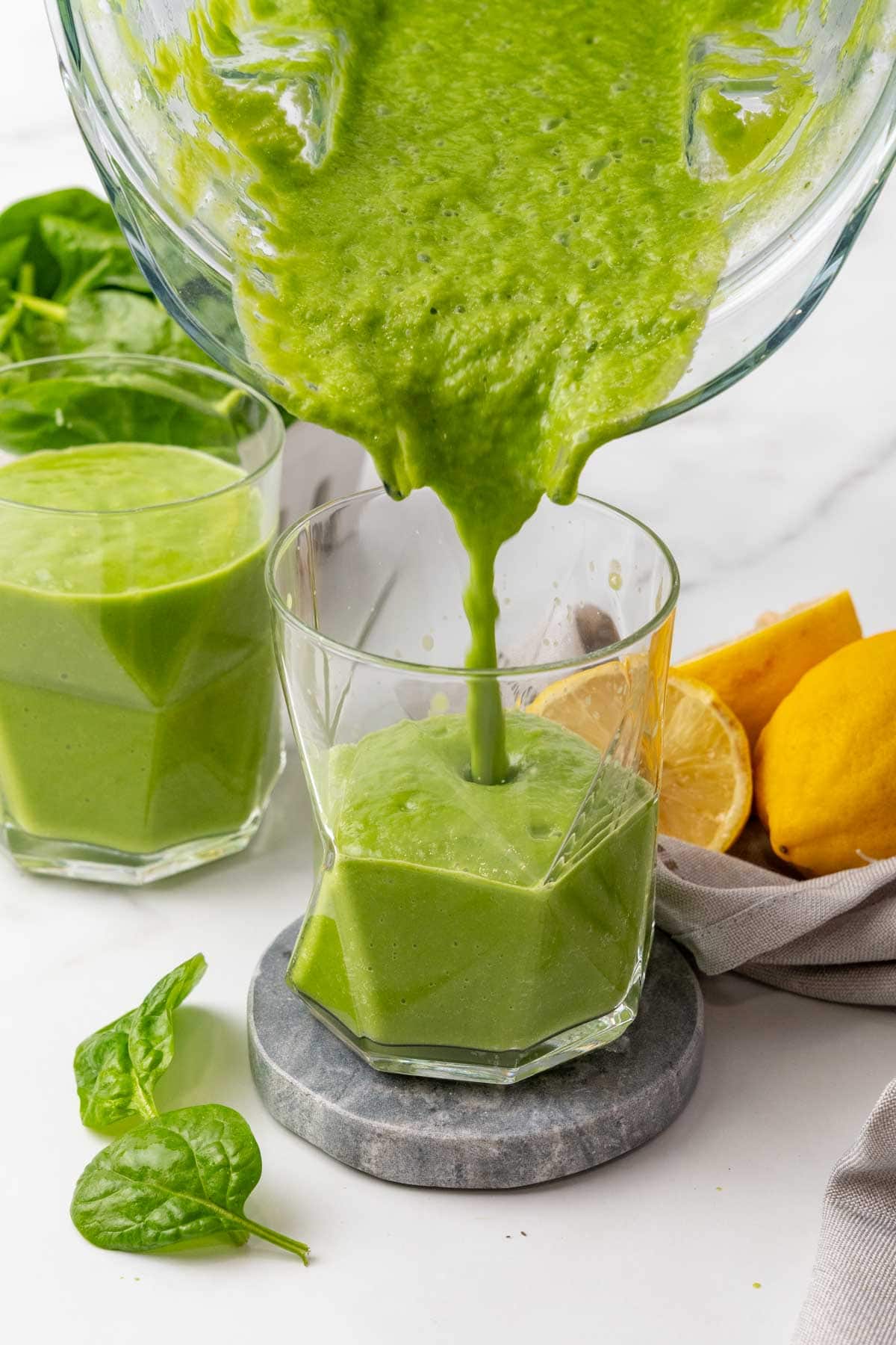 Smoothie being poured from blender into a glass