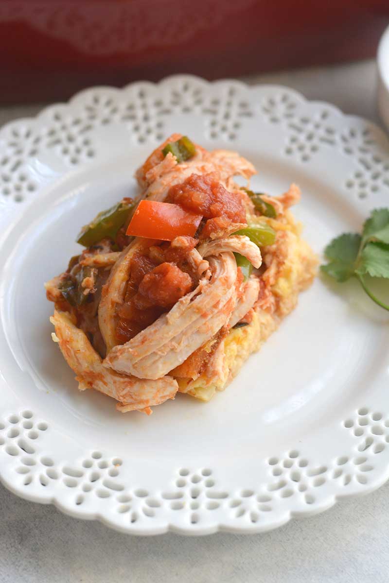 Piece of chicken cauliflower casserole on white plate