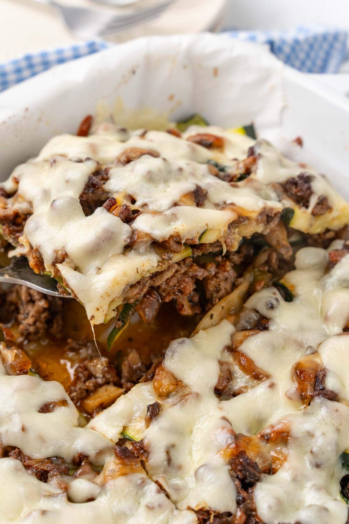 Knife cutting into the lasagna