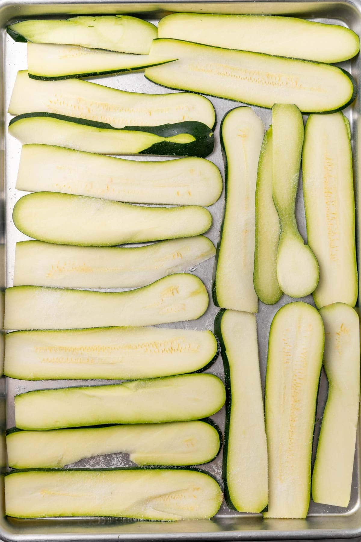 Zucchini slices on a baking plate