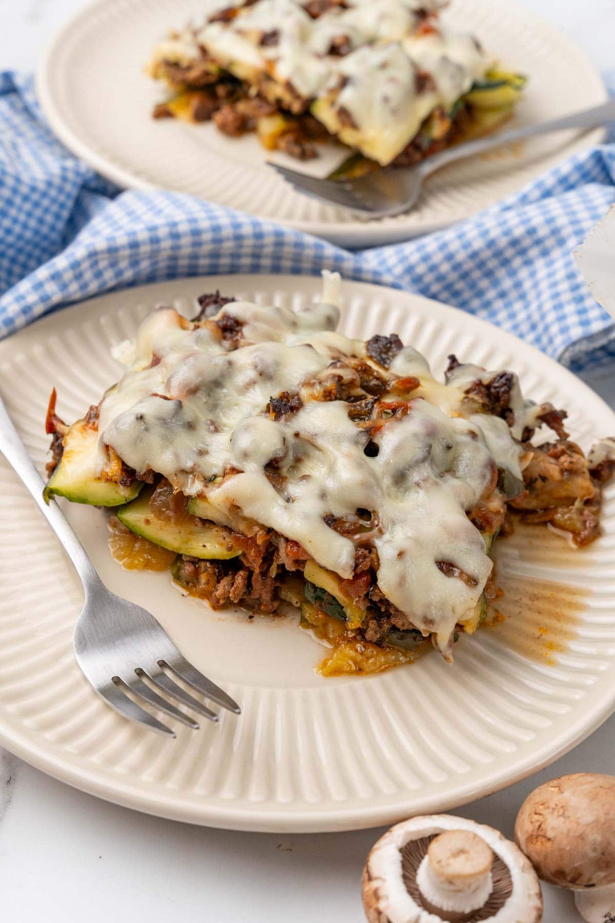 Two plates of low-carb zucchini lasagna on a table