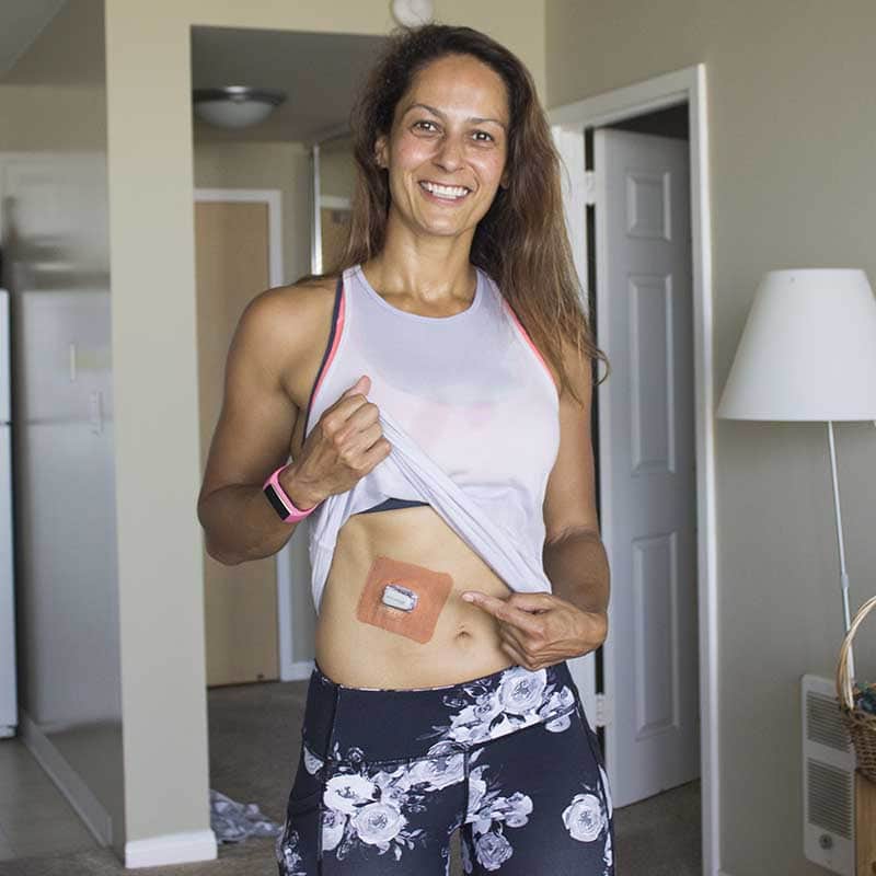 Christel with a GrifGrip Dexcom patch on her stomach