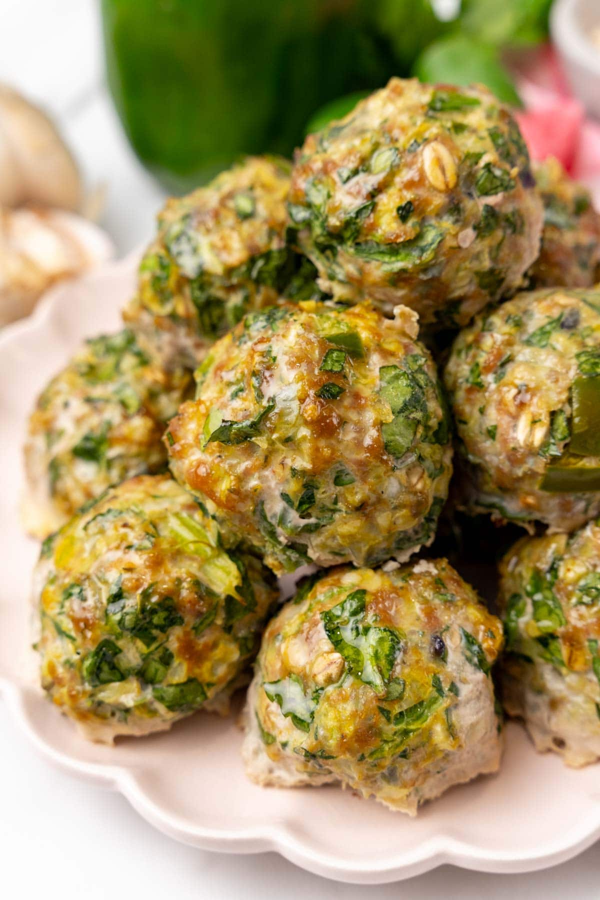 Closeup of meatballs on a white plate