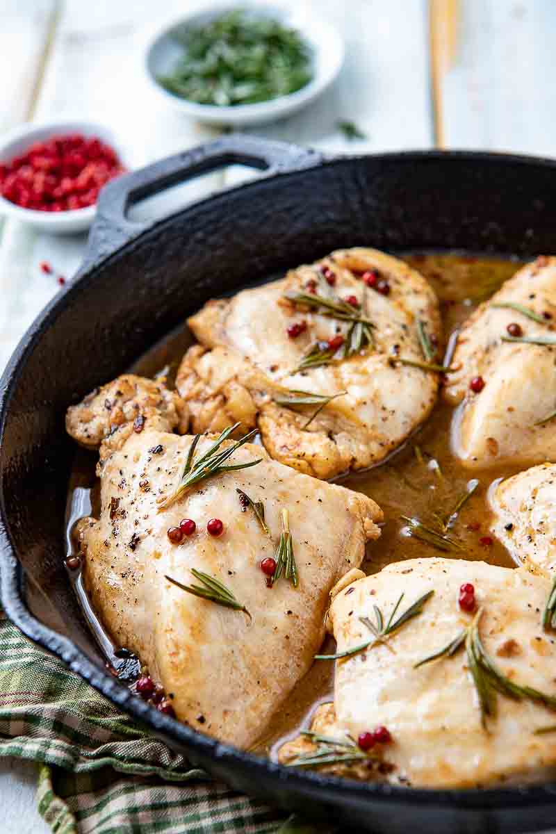 Tuscan style rosemary chicken in a skillet. 