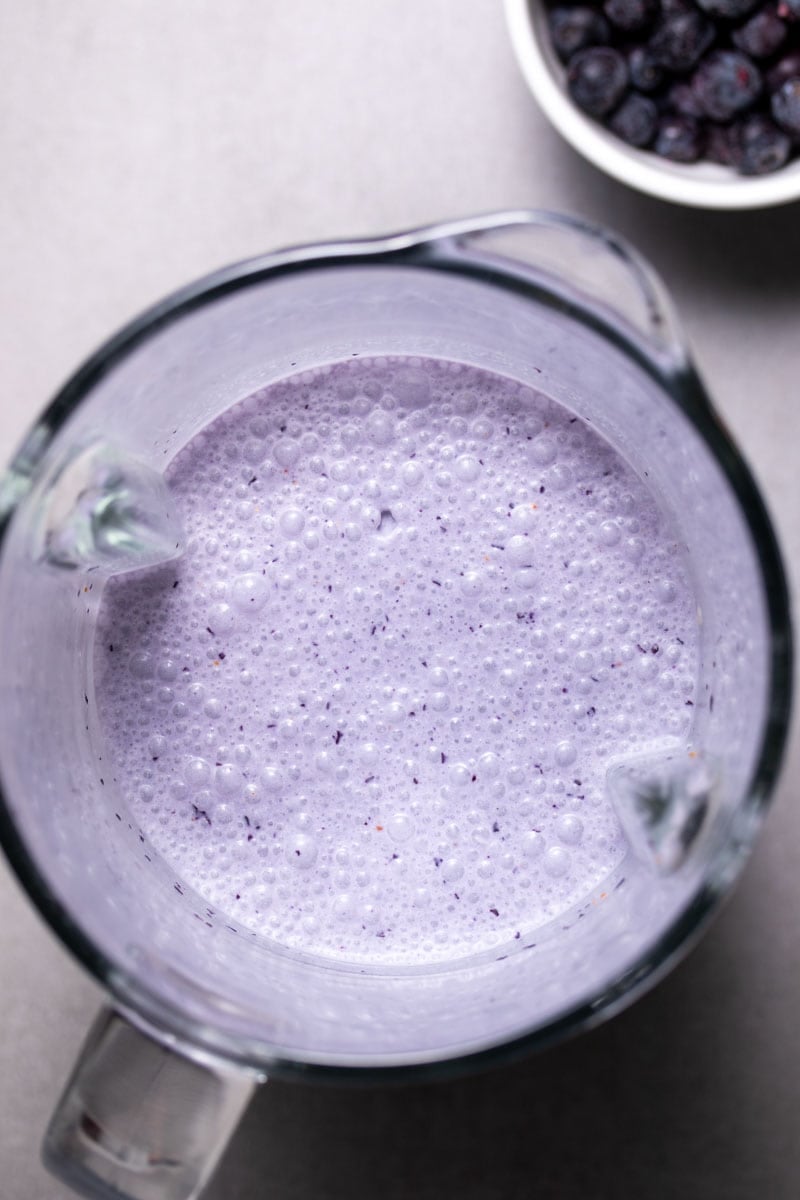 Blender with the blended smoothie ingredients, as seen from above