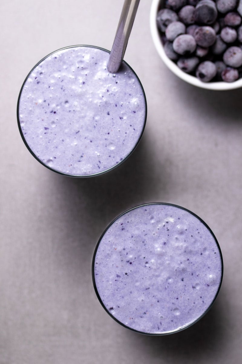 Two blueberry smoothies seen from above