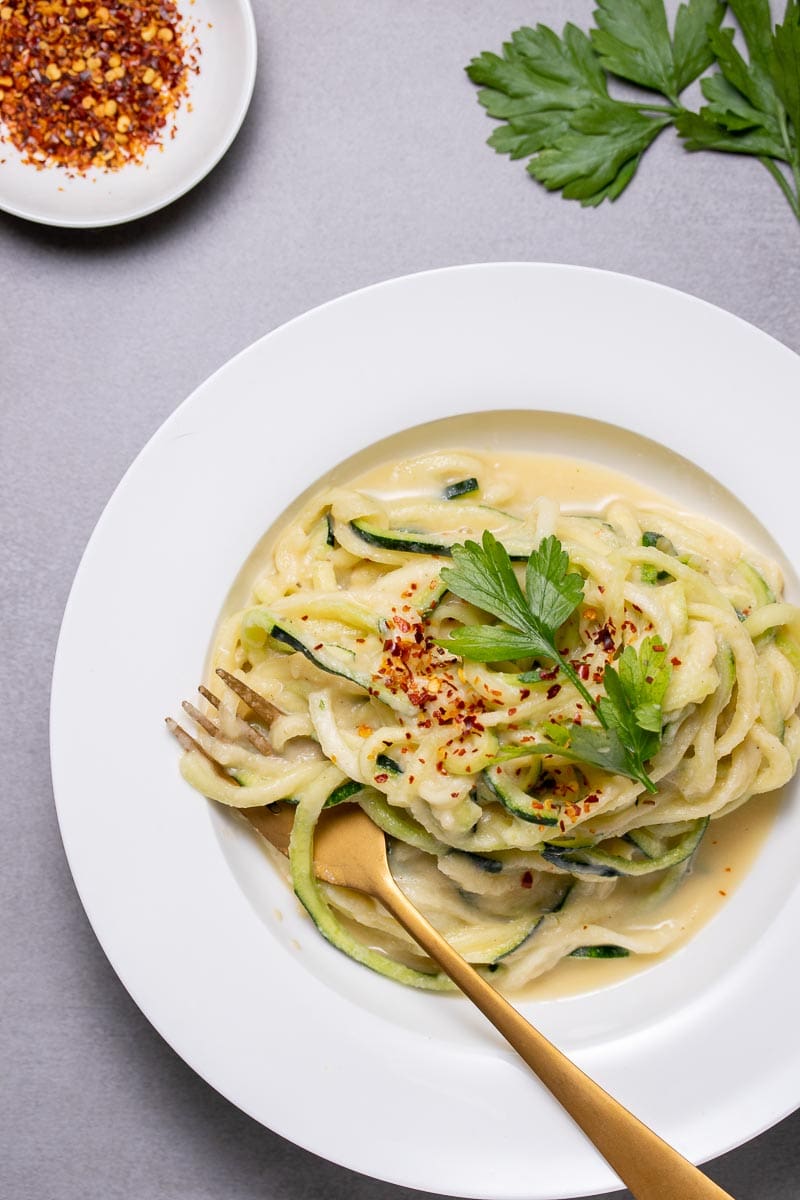 Vegan cauliflower Alfredo sauce on zucchini noodles