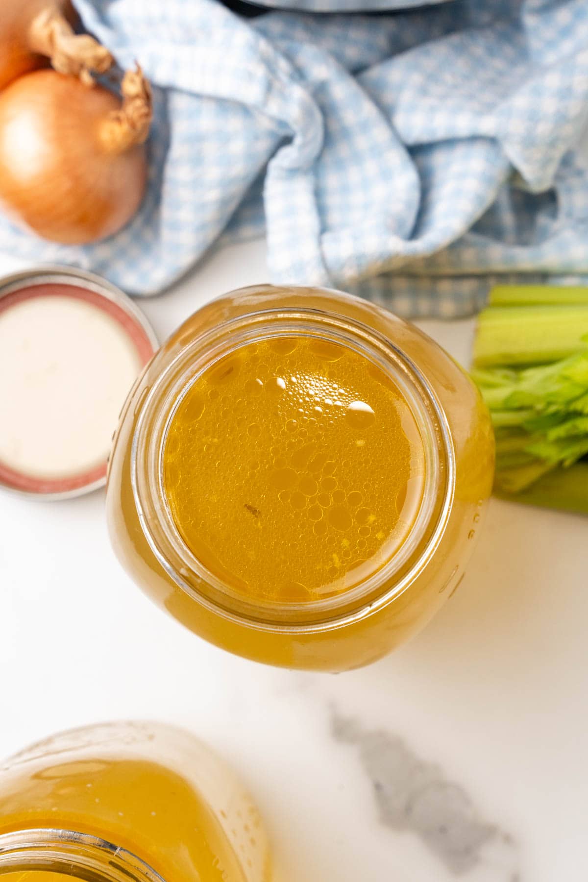 Open jar of bone broth seen from above