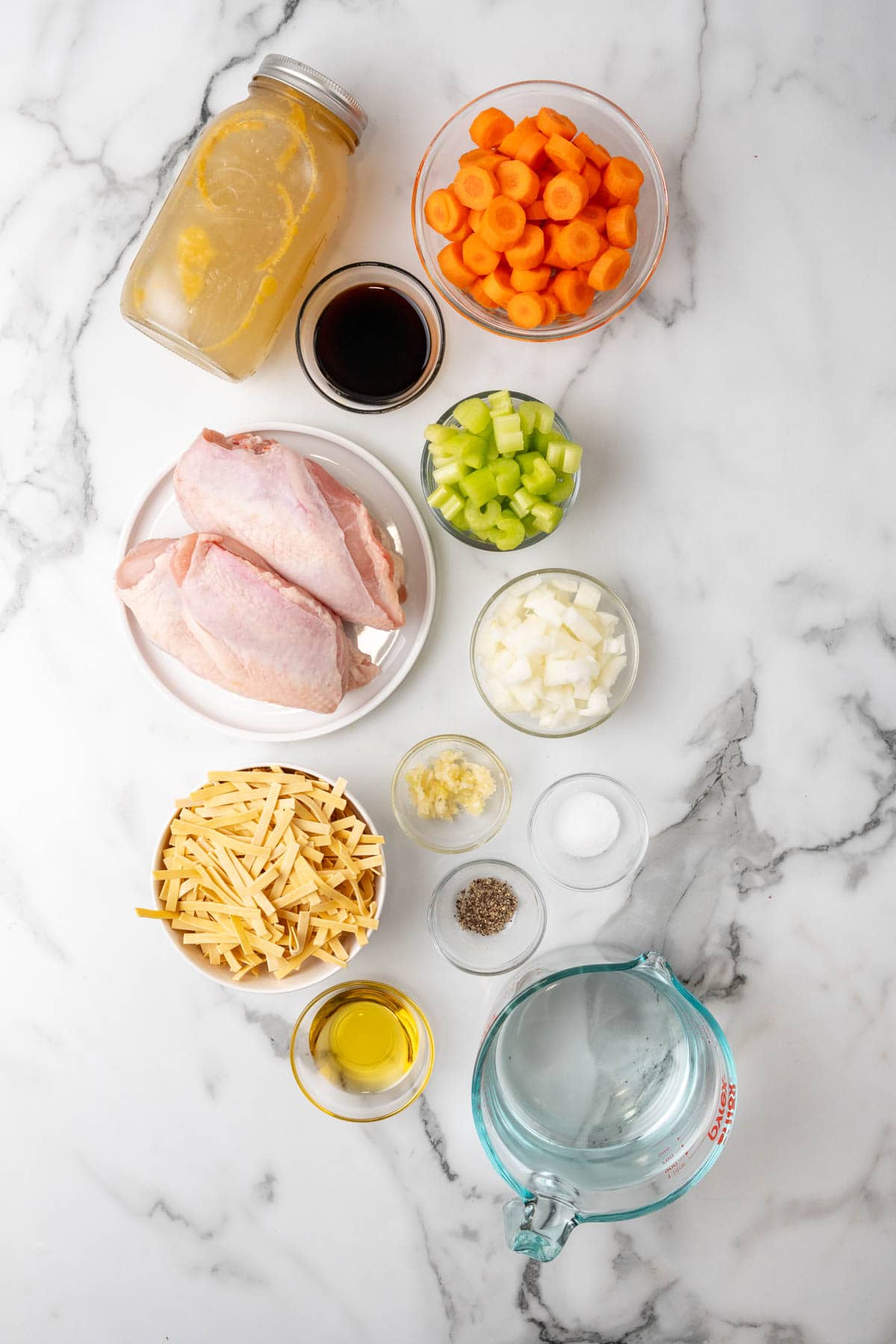 Ingredients for the chicken noodle soup on a table