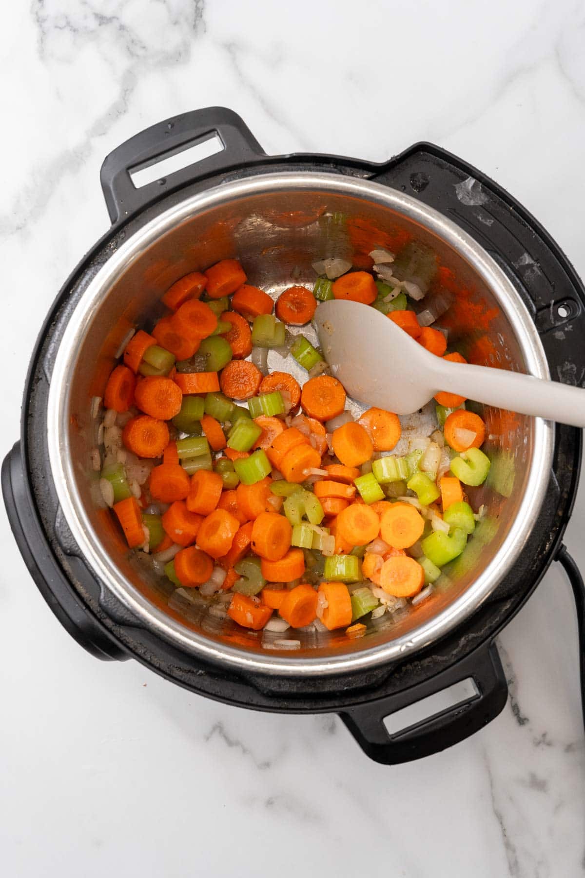 Vegetables sautéing in an Instant Pot