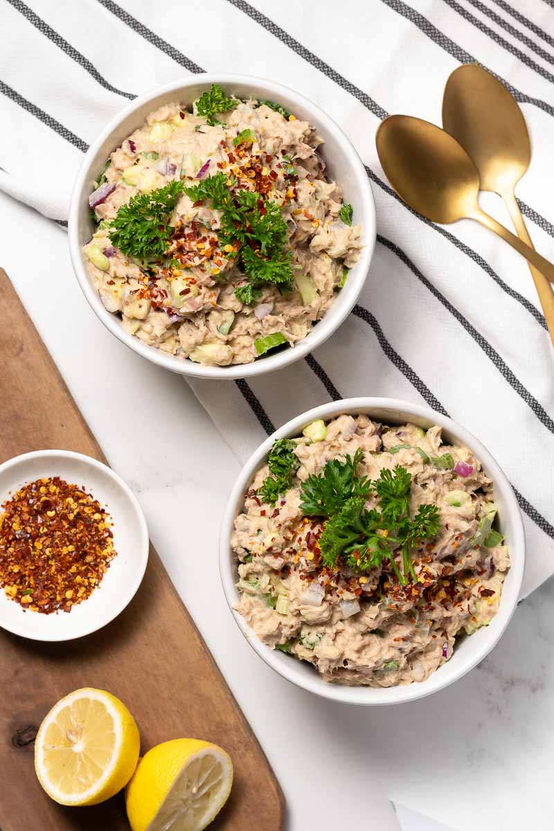 Keto Tuna Salad divided into 2 bowls and garnished with parsley, as seen from above