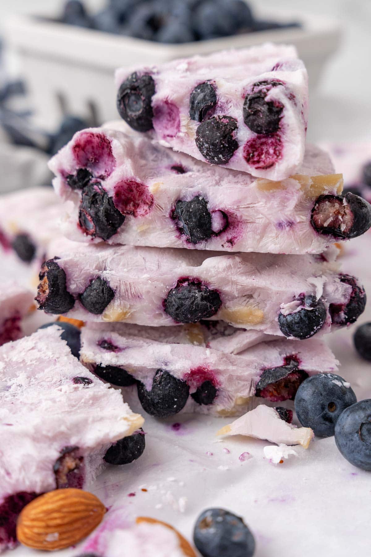 Five pieces of Frozen Yogurt Bark stacked on top of each other