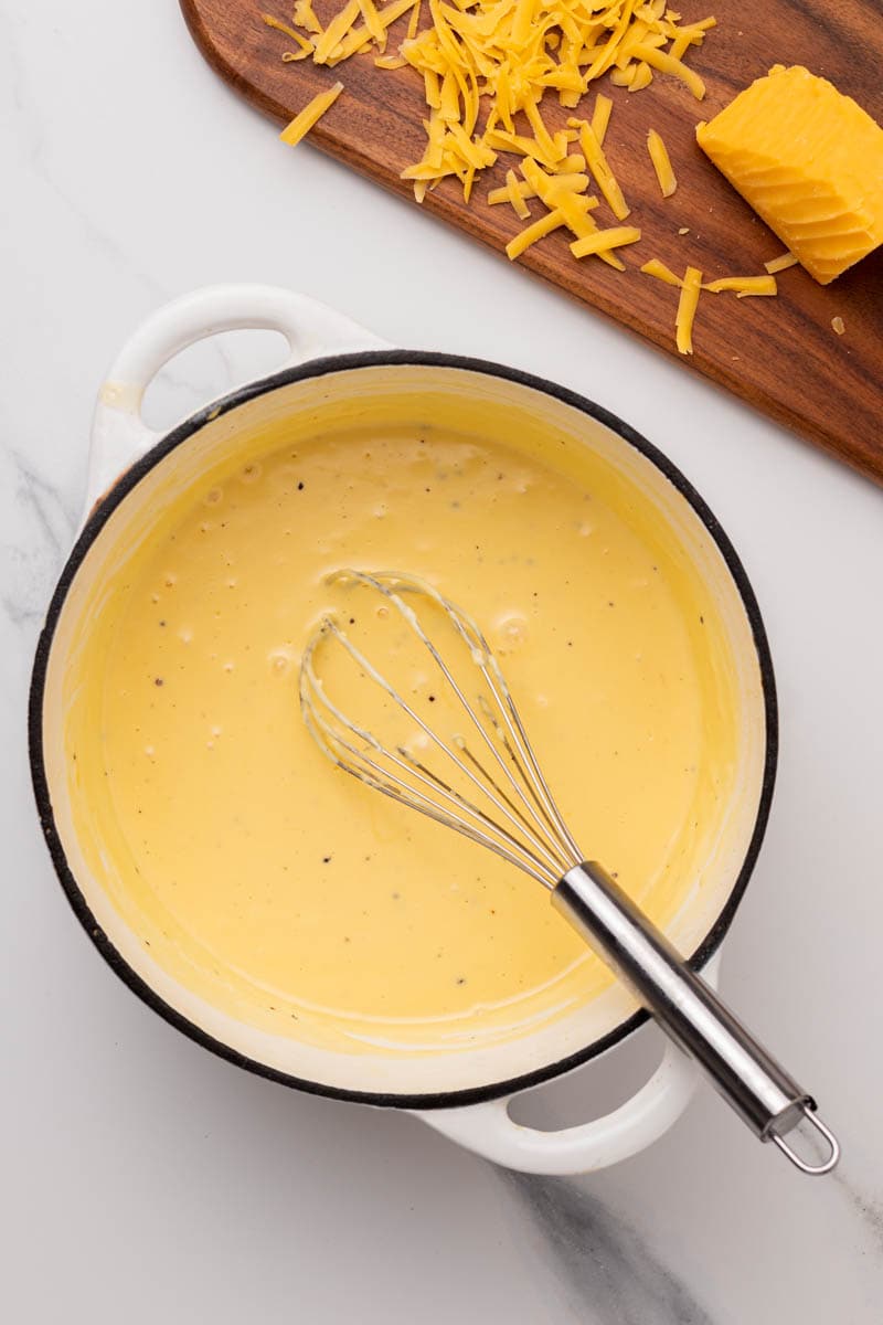 Creamy and smooth cheese sauce in a pot