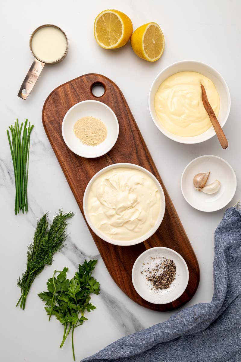 Ingredients for the ranch dressing in separate bowls, as seen from above