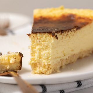 Slice of cheesecake with a bite missing