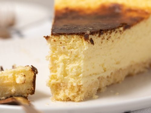 Slice of cheesecake with a bite missing