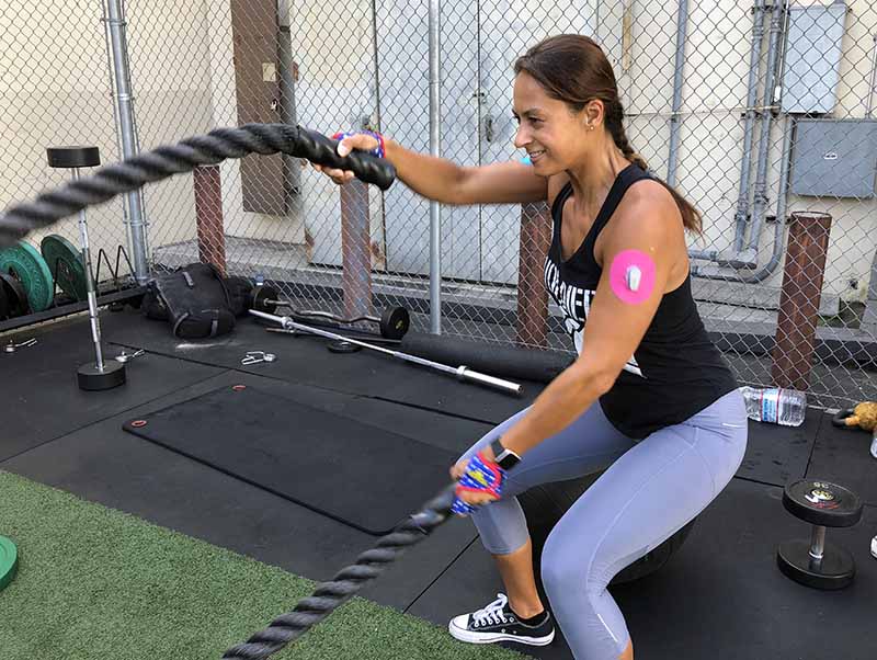 Christel exercising with her Skin Grip on the arm