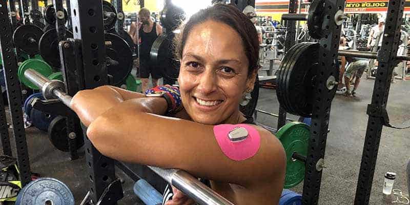 Christel at gym with Skin Grip on arm