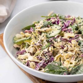 Purple cabbage salad in a white bowl