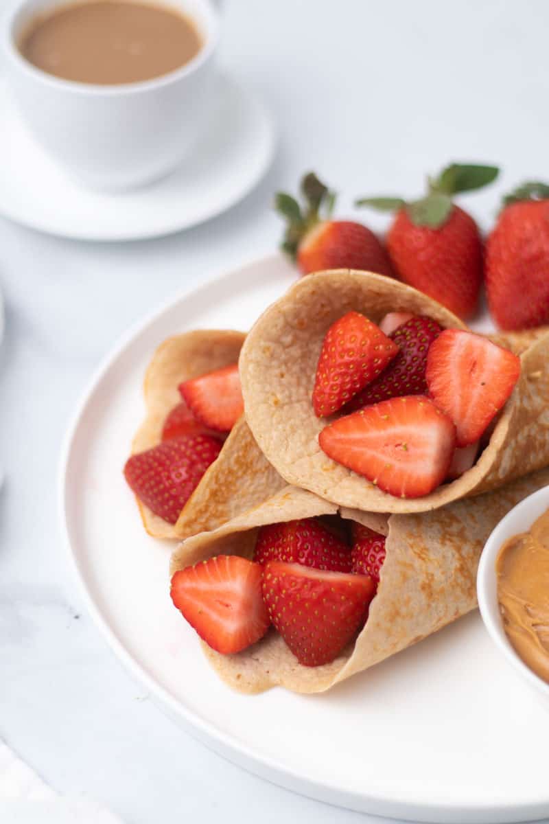 low carb cottage cheese pancakes stuffed with strawberries on a plate