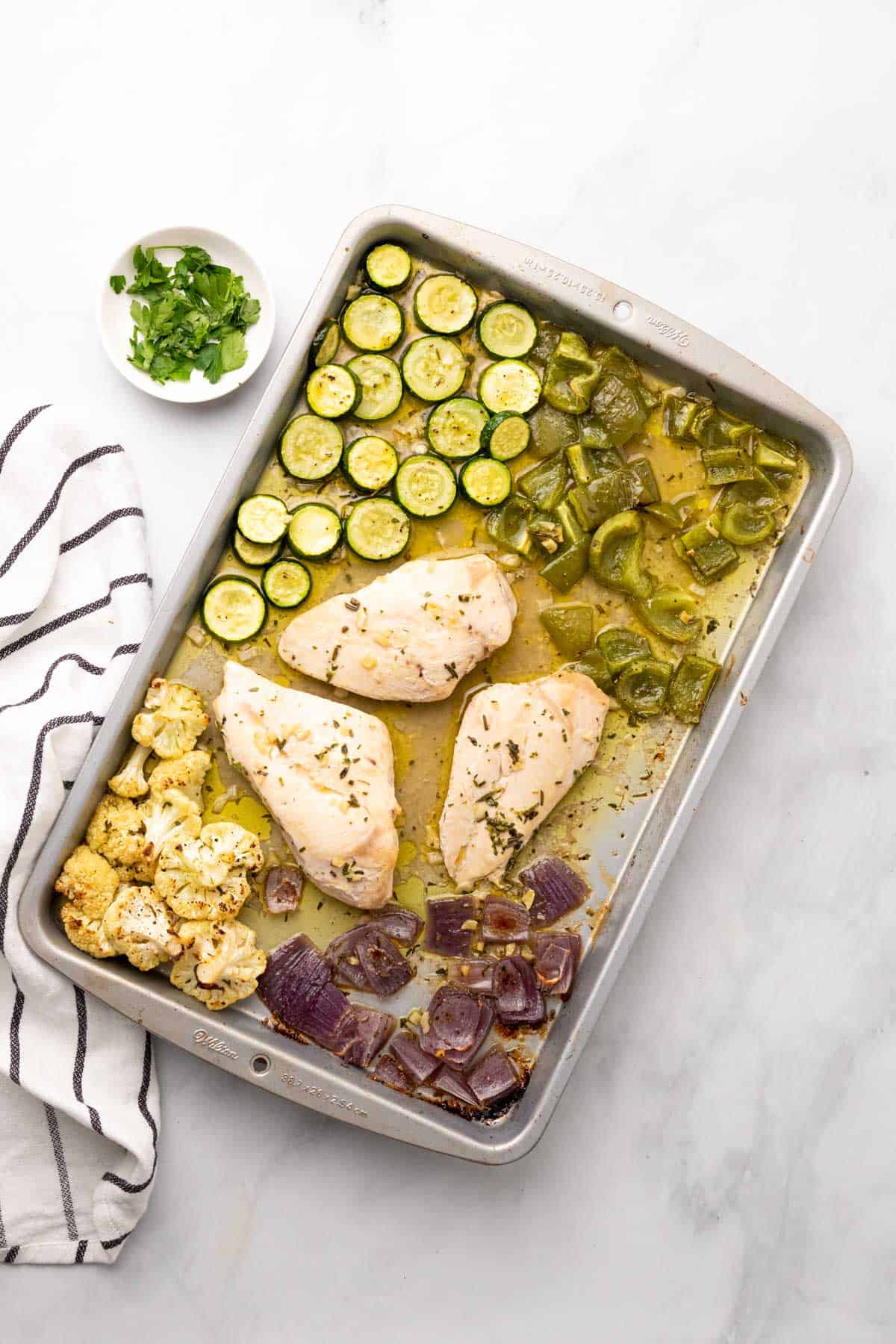 sheet pan dinner with white cloth