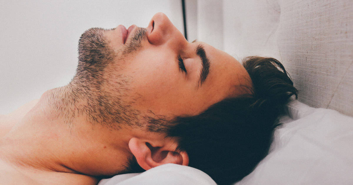 Face of man sleeping with sleep apnea