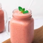 Low-Carb Watermelon Smoothie garnished with mint in a glass with a straw