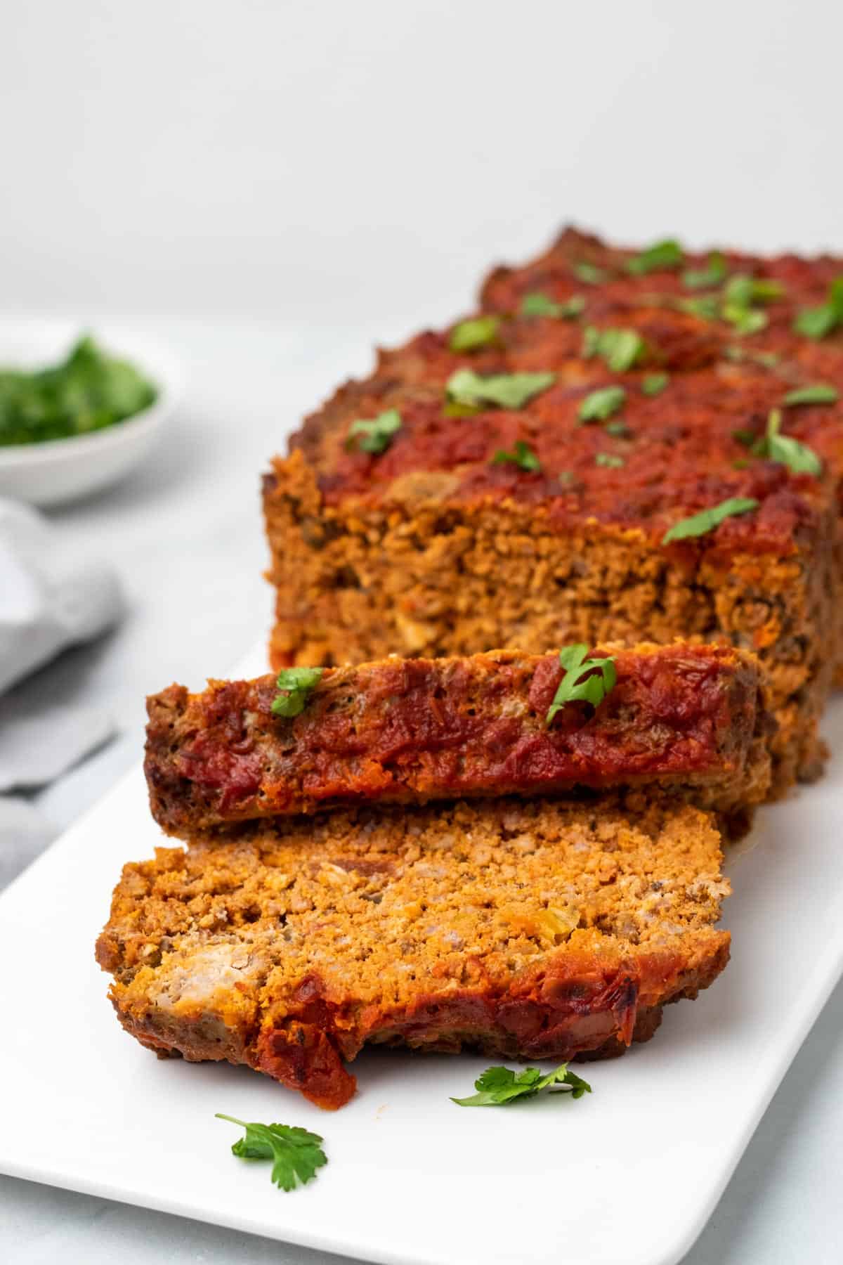 Side view of meatloaf with two slices cut