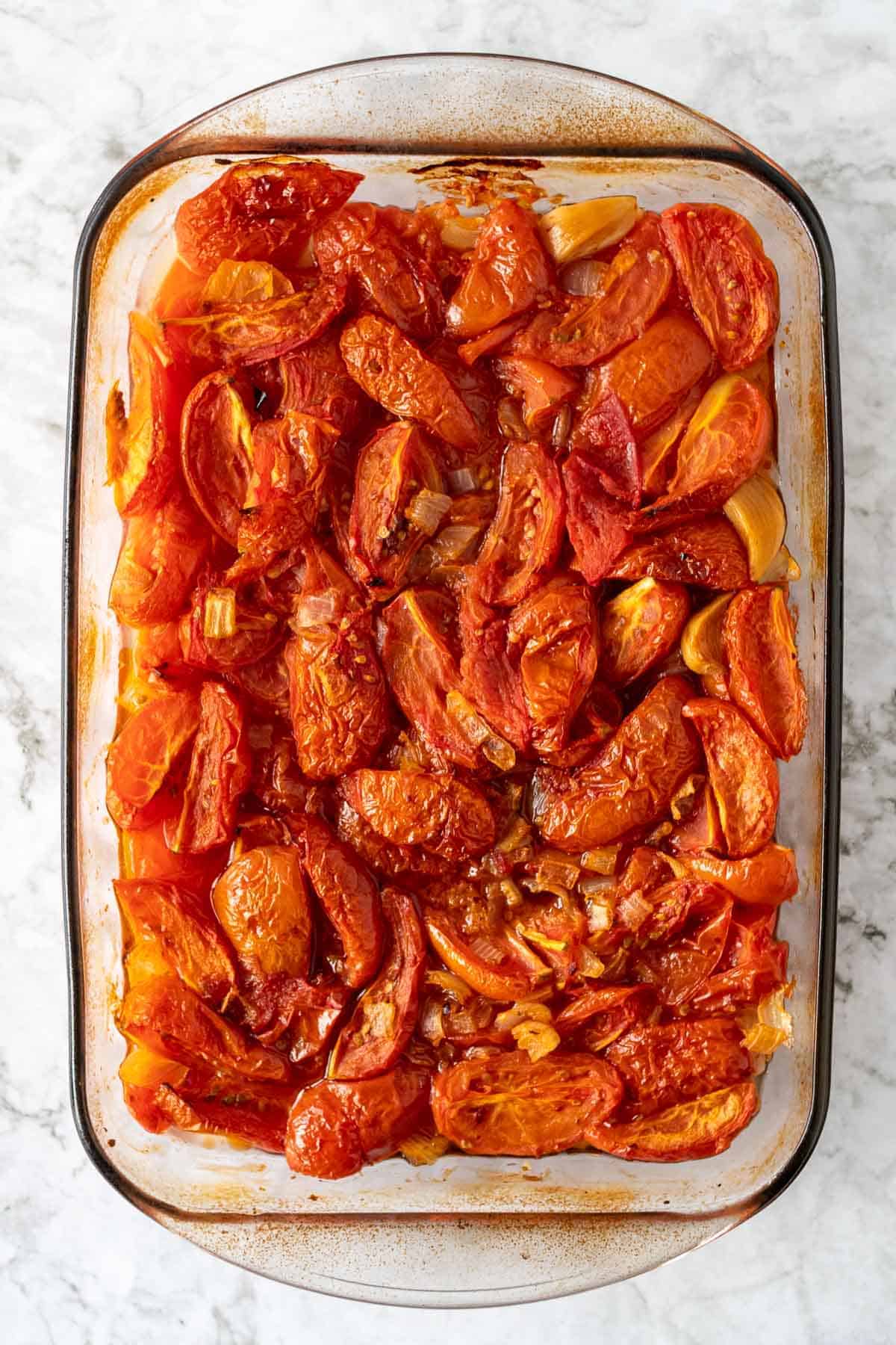 Roasted tomatoes in a glass baking pan
