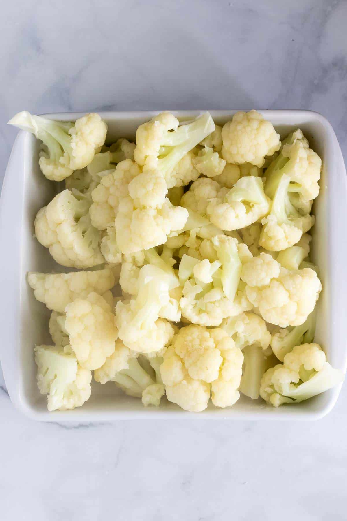 Cooked cauliflower in an 8x8 square baking dish