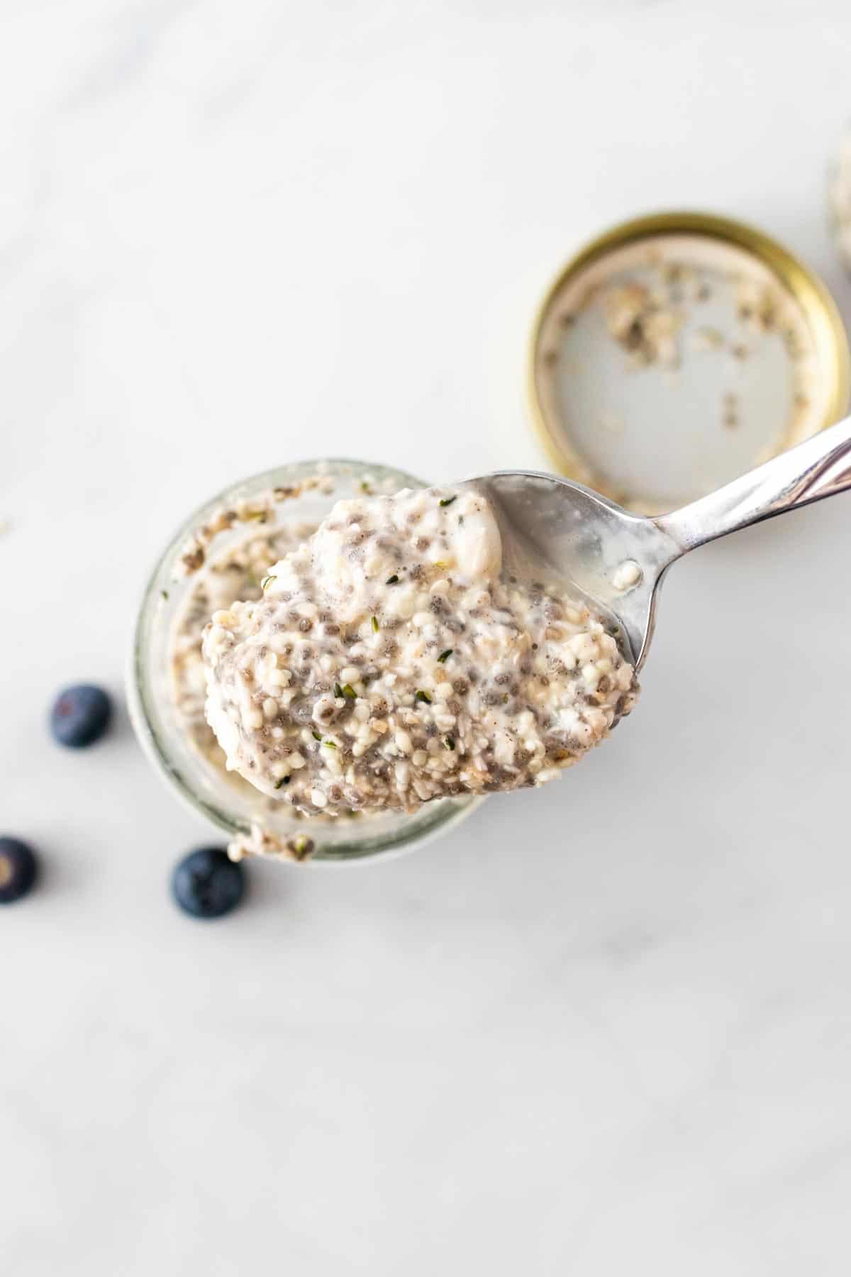 Spoonful of faux-oats held over the jar