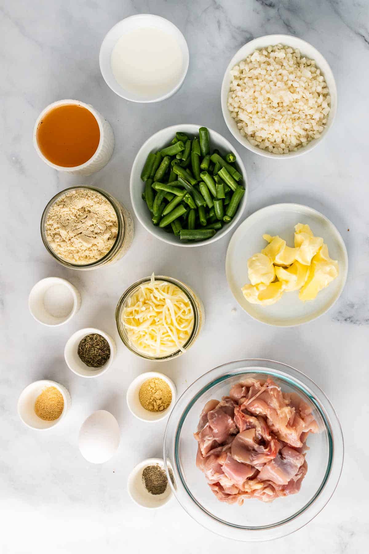 Ingredients for recipe in separate bowls and ramekins, as seen from above