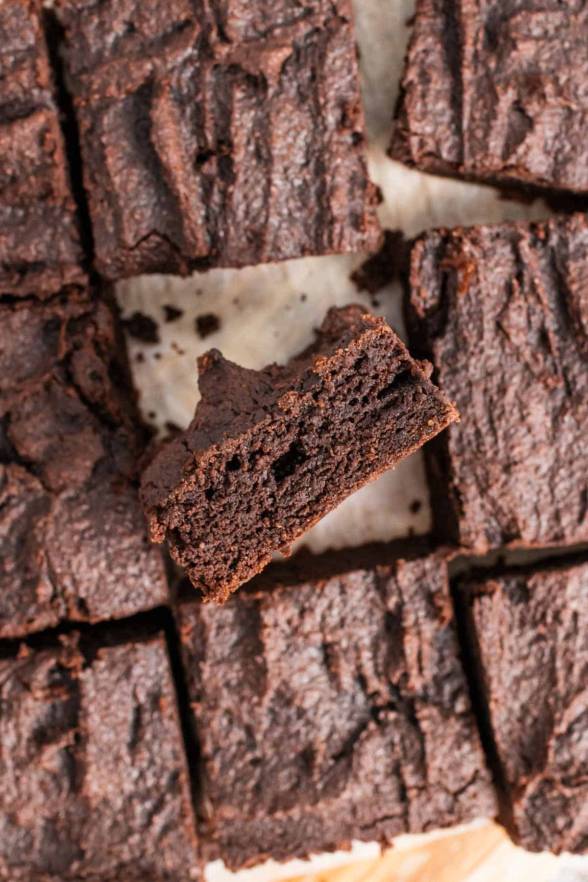 Overhead view of brownie slices with one brownie turned on it's side to show the texture