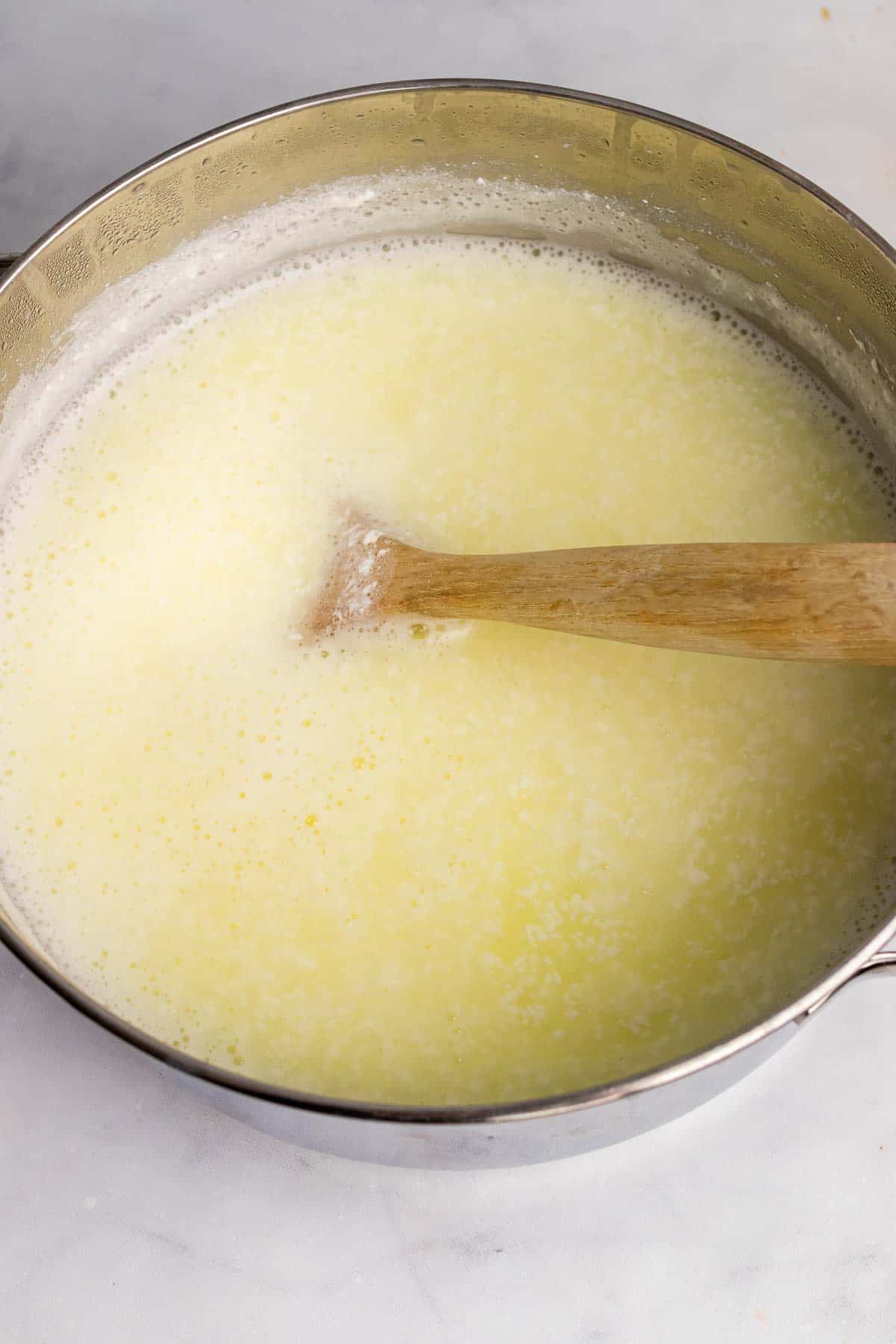 Pot with curd separating from the whey