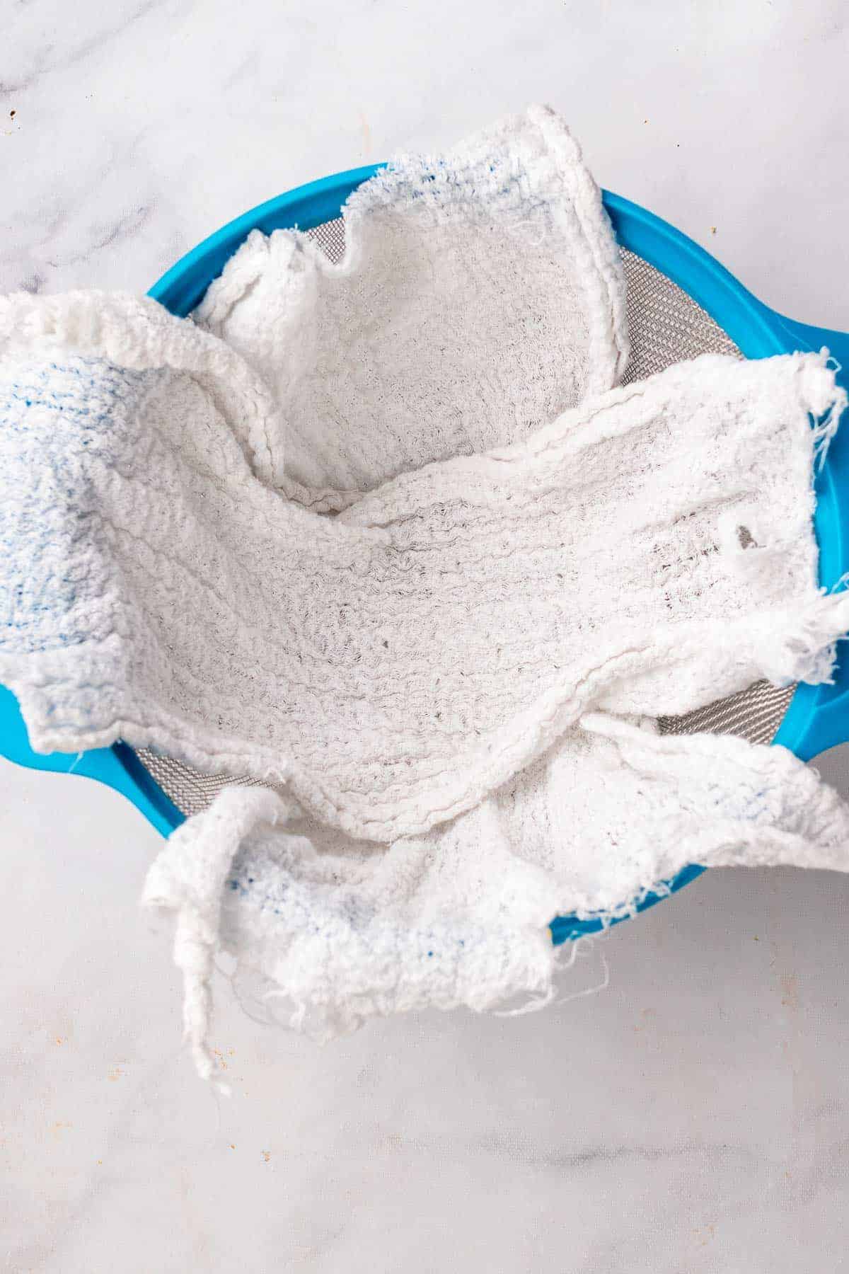 Colander with cheesecloth